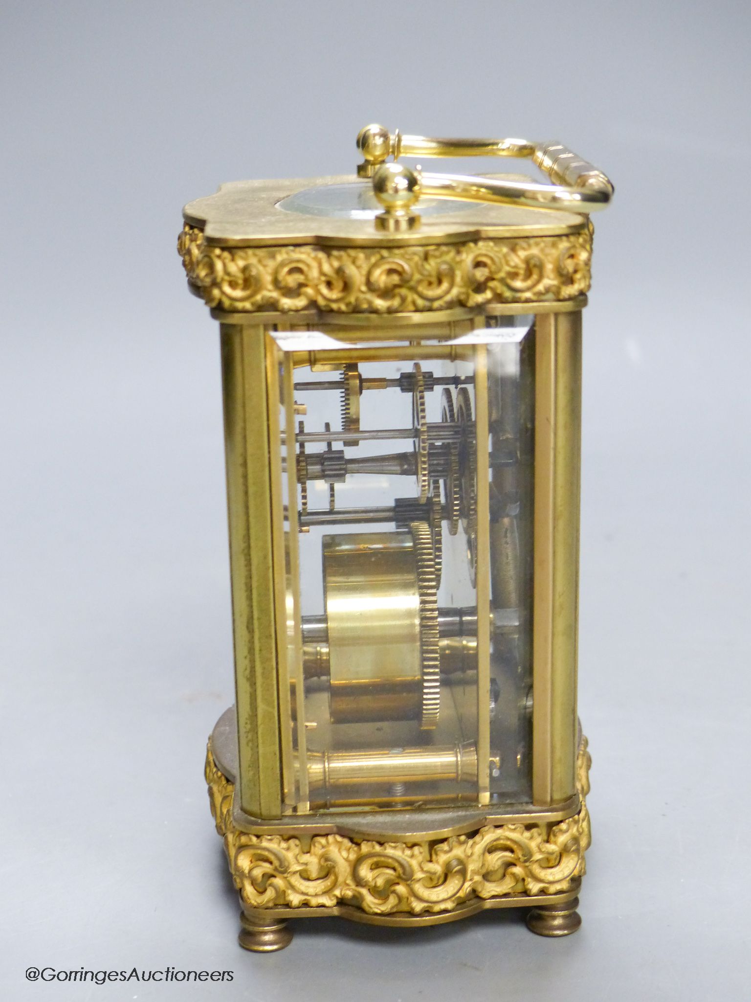 An Edwardian serpentine brass carriage timepiece, height 12cm